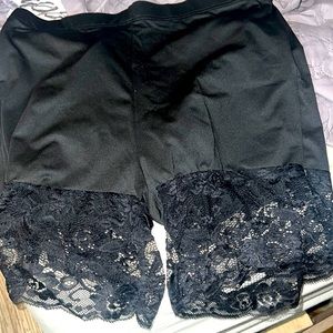 Black biker shorts with lace bottom.